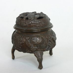 Three-legged, lidded censer decorated with the motifs of chrysanthemums, butterflies, cranes and insects.