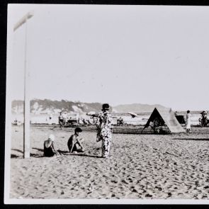 Beachgoers on the sandy beach in the bay