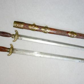 A pair of swords in sheats, with fittings