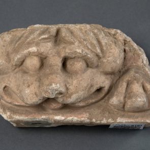 Lion head protome frieze fragment