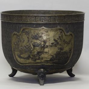 Large cachepot on four legs with depiction of the story of Kaguya hime on one side and an eagle hunting down a serpent on the other