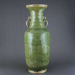 Cylindrical vase with coiling dragons among waves
