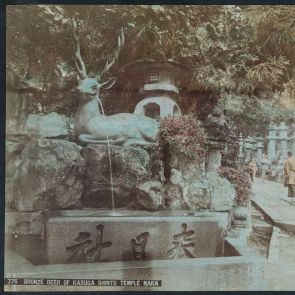 Giant roe deer statue with stone lanterns