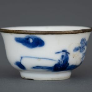 Rice wine cup decorated with a fishing figure and a poem