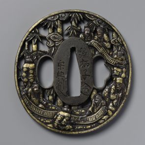 Tsuba with three slots, decorated with men reading a long scroll in a bamboo grove