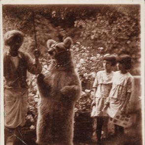 Indira and Amrita and the bear trainer with his bear