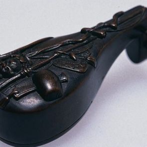 Netsuke: Biwa (Japanese lyre) with the attributes of the seven fortune gods