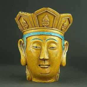 Buddha head with a crown decorated with five sitting Buddhas