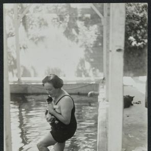 Marie-Antoinette by the swimming pool with a cat