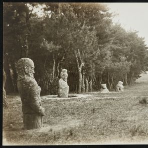 Black and white photo of roadside stone sculptures