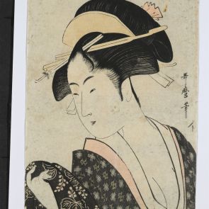 Portrait of a beauty tying her obi