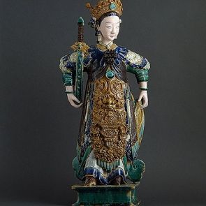 Standing female figure with a sword