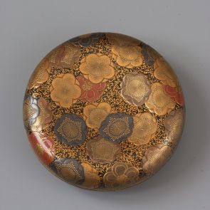 Round incense container (kōgō) with plum blossom motifs