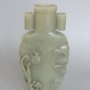 Plain vase with animals chasing flaming pearl