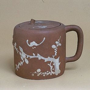 Teapot decorated with a blossoming bough, a bamboo and a bat
