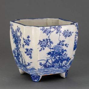 Four-legged, rectangular jardiniere with cut off corners, with floral decoration