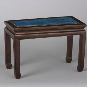 A small table with porcelain cover