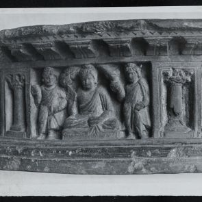 Black and white photo of Buddhas with disciples, relief detail