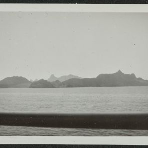Farewell to the strange rocky mountains, from the deck of the ship