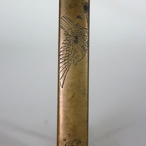 Kozuka knife handle decorated with an eagle flying across the sea