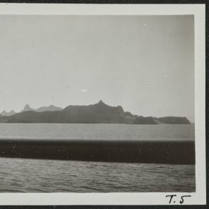 Farewell to the strange rocky mountains, from the deck of the ship