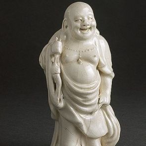 Standing Budai with a sack and a lotus