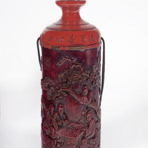 Flask decorated with old men playing beneath a pine tree and inscription